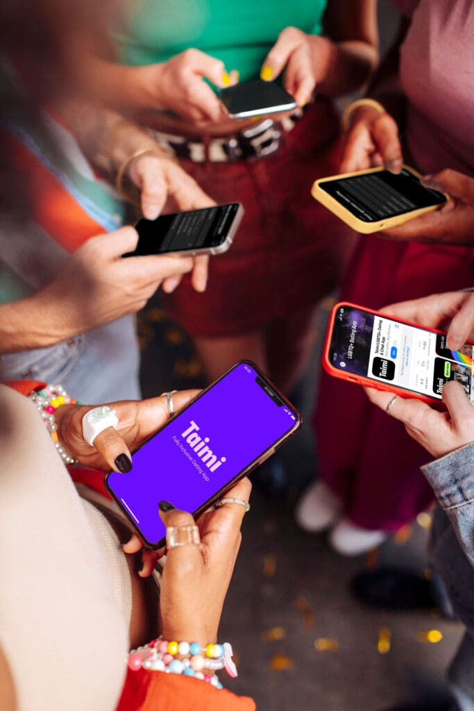 Image of people holding phones, one with the Taimi Dating app loaded