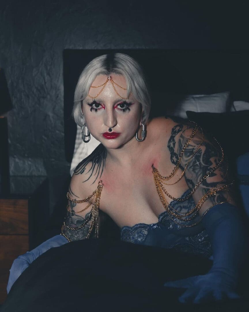 Piercing play featured image woman posing with makup and play piercing